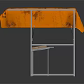 Sturdy Table With Orange Tablecloth And Lower Metal Shelf Featuring Colorful Blocks