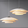 Modern White Layered Pendant Lights Hanging With Soft Lighting On Gray Wall