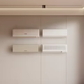 Four White Air Conditioner Fans Mounted on Light Colored Wall in Modern Interior Room