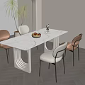 Modern Dining Room Interior With White Table Chairs Fruit Bowl And Plants