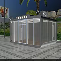 Modern Security Booth With Glass Walls On Plaza Near Green Plants And Street Lamp