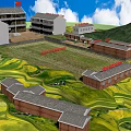 School Buildings Complex With Central Playground And Red Flag In Green Mountainous Fields
