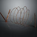Rusty Coiled Barbed Wire Structure With Wooden Stakes And Spiral Form