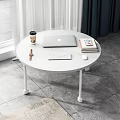 Round White Dining Table With Laptop Keyboard Mouse Coffee Cup Books And Watch Near Window