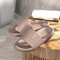 Comfortable Brown Striped Slippers With Soft Cushioned Sole Placed On Wooden Tray For Home Use