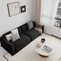 Black Two Seater Sofa with White Grey Cushions Brown Throw Near Round Coffee Table and Window