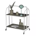 Stylish Two Tier Metal Cart With Wheels Holding Plant Vase Lamp Candles And Book
