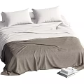 Double Bed With White Pillows White Sheets Gray Blanket And Stacked Books Nearby