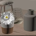 Decorative Items on Wooden Table White Daisy in Ceramic Mug Woven Glass Gray Cylindrical Vases