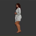 Woman Wearing White Bathrobe Standing Barefoot With Hands On Front Against Gray Background