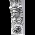 Intricate Carved Stone Column With Classical Face Sculpture And Ornamental Details
