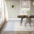 Light Gray Upholstered Dining Chairs With Black Metal Legs By Wooden Round Table And Vase