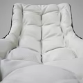 Modern White Padded Lounge Chair with Dark Trim Metal Legs and Matching Ottoman