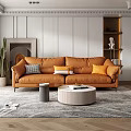 Orange Double Sofa With Decorative Pillows Round Coffee Table And City View Through Window