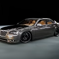 Sleek Modern Silver Sedan With Black Alloy Wheels And Brown Leather Seats