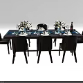 Modern Dining Table Set with Six Chairs Flower Arrangements Wine Bottle Glasses and Tableware