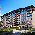 Modern Multi Story Residential Building With Greenery Trees And Pathway