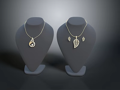 Fashionable Gold Necklaces With Teardrop And Leaf Shaped Pendants On Mannequin Displays 3d model