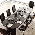 Black Conference Table With Office Chairs Laptops Documents Water Bottles And Microphones