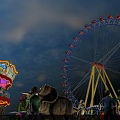 Amusement Park Scene With Ferris Wheel Carousel Dinosaur Model And Balloons Under Blue Sky