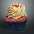 Delicious Cupcake With Red Cake Base Blue Liner White Frosting And Orange Drizzle