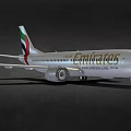 Emirates Passenger Airplane With Silver Body And Branding On Dark Background