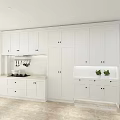 Modern White Kitchen Interior With Cabinets Countertop Fruits And Jars
