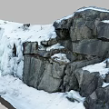 Garden Landscape With Thick Snow On Rocks And Cascading Ice Waterfall