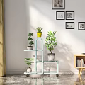 Bright Indoor Garden Decor With Multi Tiered Shelves Potted Plants And Wall Art