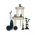Elegant Blue Black Vases With Flowers And Potted Plants On Round Tiered Stand