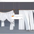 White Curtains Hanging On Wooden Rods With Bow Ties And Pleated Design