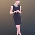 A Woman In Sleeveless Black Dress Wearing Necklace Holding Smartphone