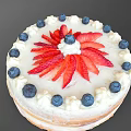 Homemade Round Layered Cream Cake Topped With Fresh Strawberries And Blueberries