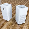 Two White Air Purifiers As Daily Electrical Appliances Placed On Wooden Floor