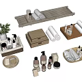 Bathroom Decorative Accessory Set With Rolled Towels Trays Bottles Wooden Boxes And Green Plant