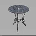 Round Blue Side Table With Intricate Carved Lace Design And Metal Legs