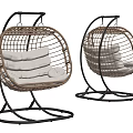 Two Modern Rattan Swing Chairs With White Cushions And Black Metal Frames