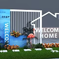 Floral Display Welcome Home Entrance Featuring White House Outline Flamingo Statues Green Plants And Flowers