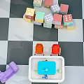 Colorful Toy Blocks With Toy Car And Sink On Checkerboard Floor