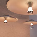 Three Modern Wall Lamps On Wall With Round Shades And Visible Light Bulbs