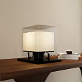 Modern Textured Square Table Lamp With Black Base On Wooden Table And Beige Wall