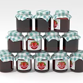 Strawberry Jam Filled Glass Jars Stacked in Pyramid Shape on White Background