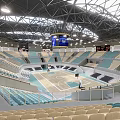 Modern Indoor Sports Fitness Arena Featuring Basketball Court Green Seats And Stands