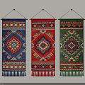 Three Colorful Decorative Wall Hangings With Geometric Patterns And Tassel Details