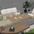 Beige Outdoor Sofa Set With Wooden Coffee Table And Green Plants On Stone Patio