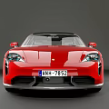 Red Porsche Electric Sports Car with Sleek Modern Design and Alloy Wheels on Gray Backdrop