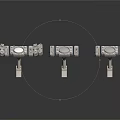 Three Metal Mechanical Components With Circular Centers And Mounting Rods