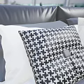 Modern Leather Double Bed With Gray Checkered Quilt And White Gray Pillows