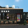Black Exterior Container Building for Campsite Barbecue with Bar Counter Stools and Green Plants