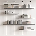 Modern Black Shelving Unit With Stacked Books And Decorative Figurines